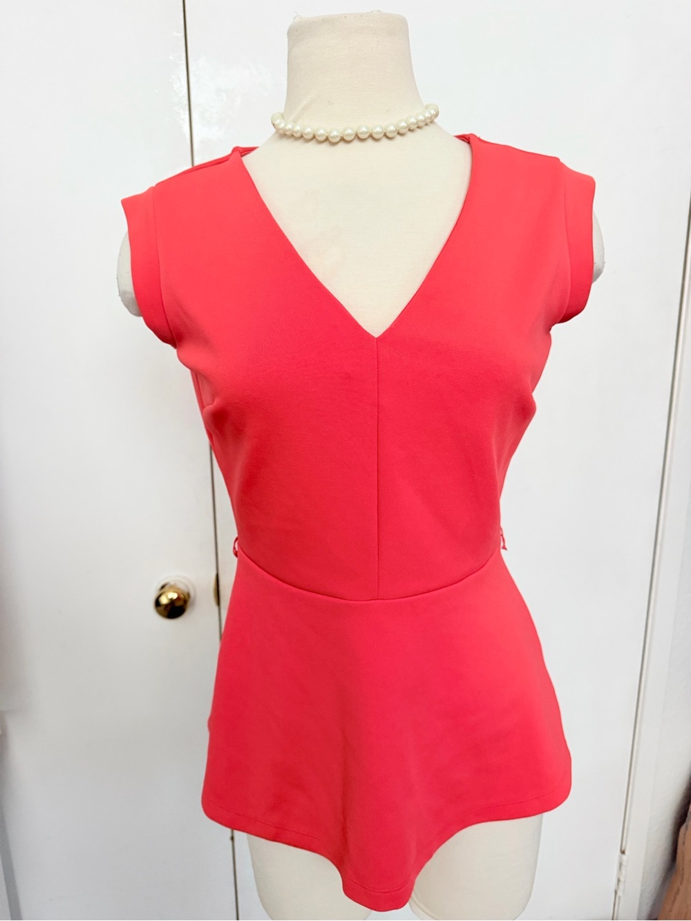 Vibrant Coral V-Neck Peplum Top